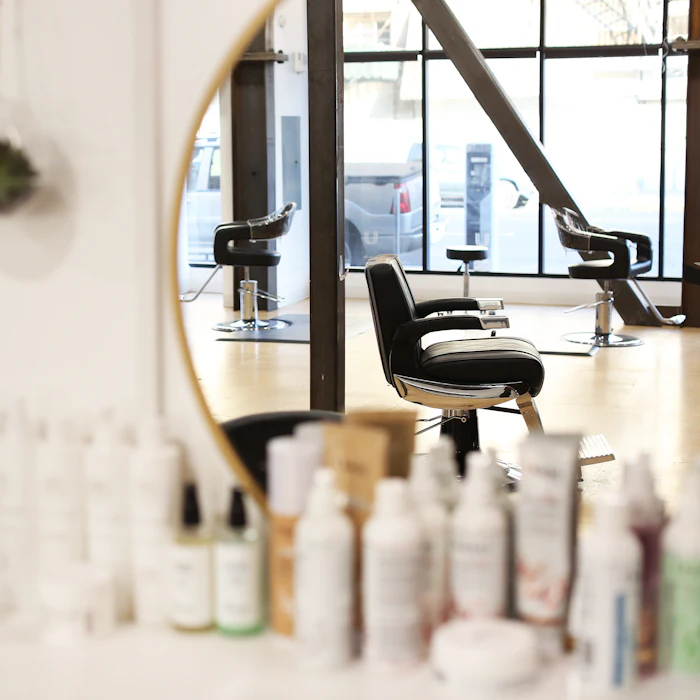 Styling chair beside a shelf of professional products