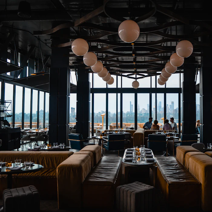 Upper dining room laid for a private party at dusk